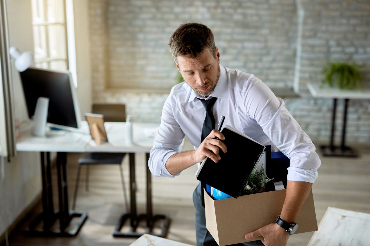 image of a man putting his things from the office away as Bungie lays off over 200 employees