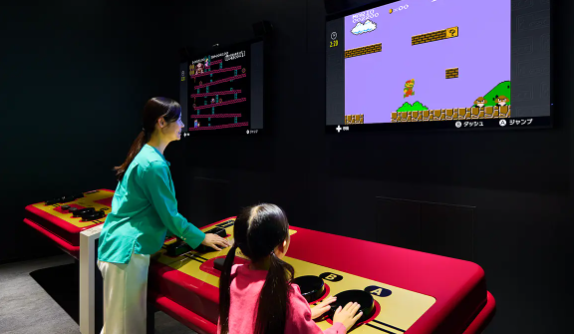 Playing Super Mario on the Big Controller inside the Nintendo Museum