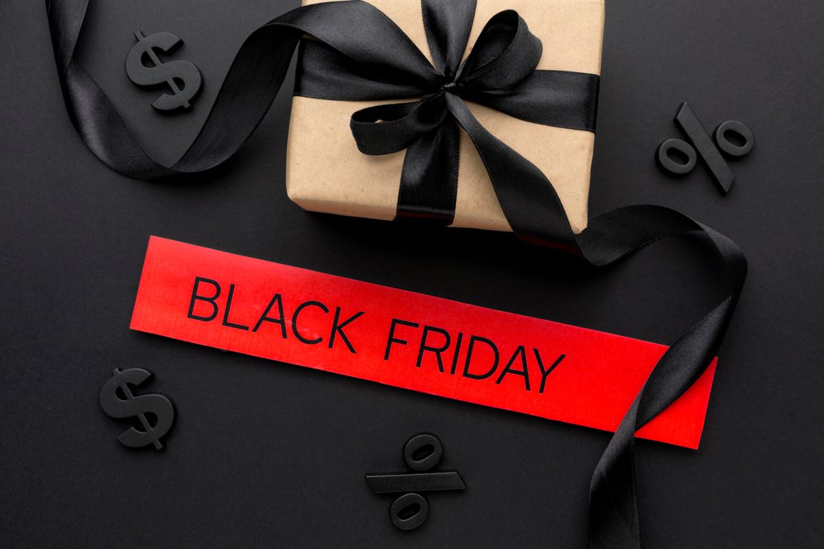 image of gift box with black ribbon and black Friday in red text to show support for the upcoming black friday deals 2024